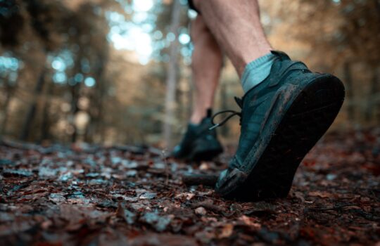 close-up-of-a-man-hiking-in-the-forest-with-a-focu-2025-02-02-22-33-27-utc